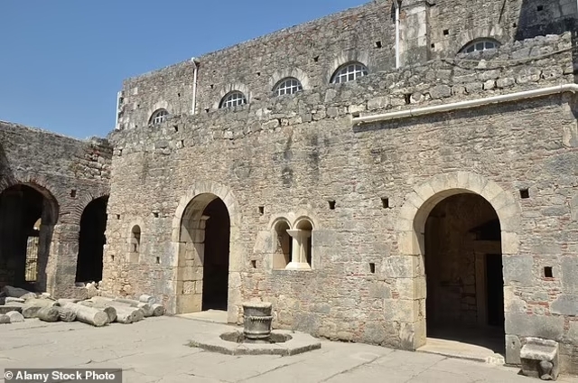 The sturdy stone facade of the Church of St. Nicholas, a revered site for pilgrims and history enthusiasts alike.