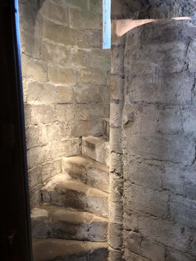 The winding staircase within The Rock of Cashel, inviting visitors to explore its historical depths.