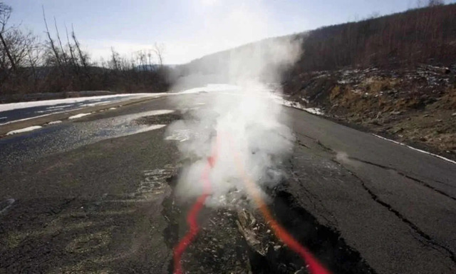 Thick white smoke rises from the cracks in Centralia’s asphalt, a haunting reminder of the underground inferno that refuses to die out.