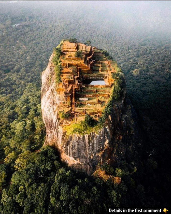 The eastern face of Sigiriya rock, cloaked in lush jungle, is crowned by a majestic citadel built by King Kashyapa I in the late fifth century A.D., standing proudly in central Sri Lanka.