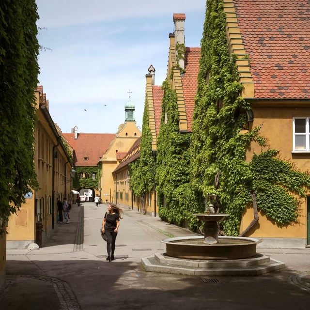 Every dwelling in the Fuggerei boasts a private entrance and uniquely designed doorbells, while shared spaces include a baroque chapel, a beer garden, and a communal mess. © Jens Schwarz for the FT