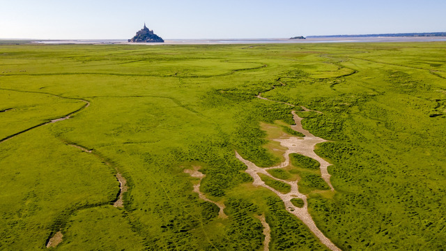 A breathtaking aerial view of Mont Saint-Michel in northern France. The Paris Basin region is celebrated for its prehistoric funerary sites, offering archaeologists valuable insights into early Neolithic communities. (Credit: David Briard/Getty Images)