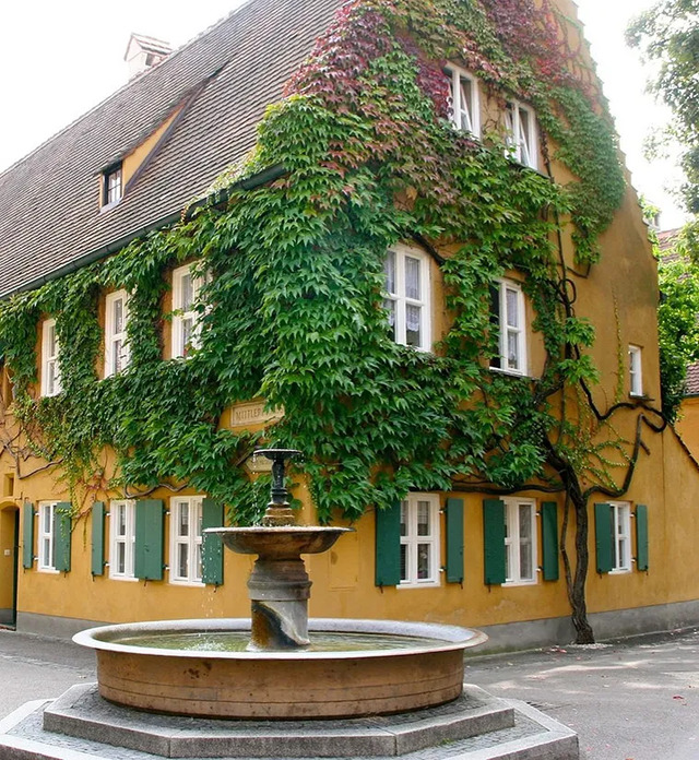 A beautifully preserved cast iron fountain from the 18th century, adding to the historical ambiance of this iconic housing complex.