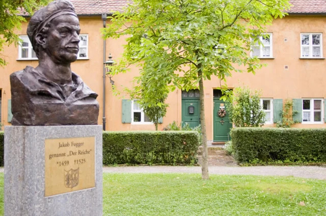 A bust of Jakob Fugger, famously known as "The Rich," proudly displayed at the Fuggerei.