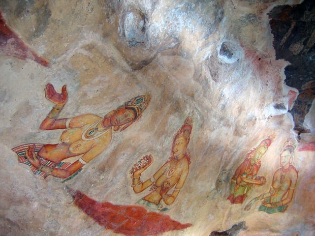 The frescoes at Sigiriya depicting apsaras, celestial maidens, celebrated for their elegance and delicate artistry, representing a pinnacle of Sri Lankan art.