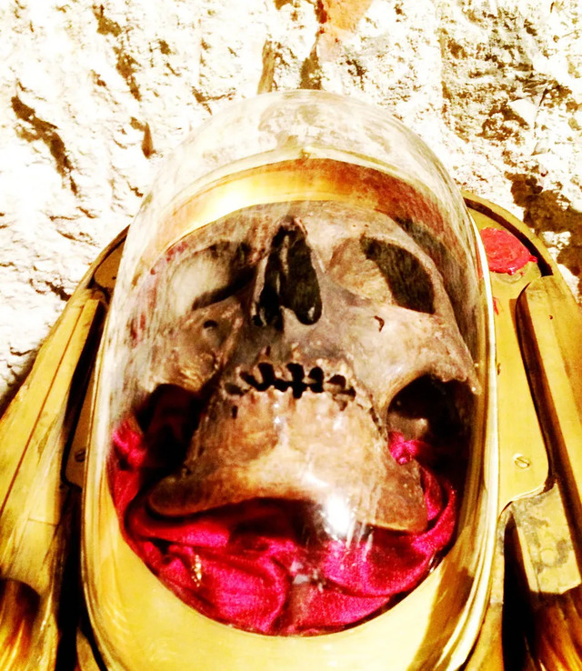 A closer view of the reliquary displaying the skull, encased in gold and glass, reflecting centuries of reverence and religious tradition. (Credit: X user @tradlamb)