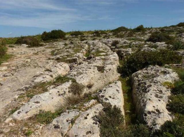 The mysterious cart ruts of Malta, found at Misrah Ghar il-Kbir, also known as “Clapham Junction.” (Ronny Siegel/Flickr)