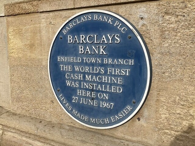 A plaque marks the site of the now-lost cash machine—though there’s no mention of Reg Varney. Image: Matt Brown.