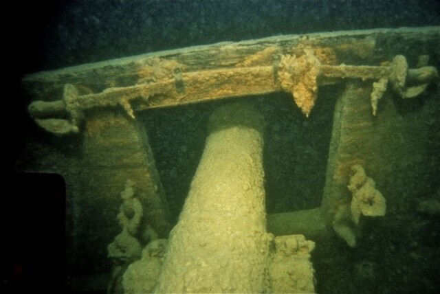 A preserved cannon lies on the deck of one of the shipwrecks, offering a glimpse into naval warfare during the War of 1812.