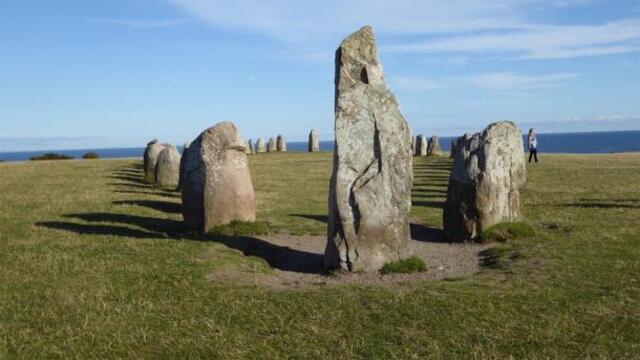 A prominent large stone marks the end of the Ales Stenar formation, standing out among the ancient arrangement. (msurkamp / Adobe Stock)