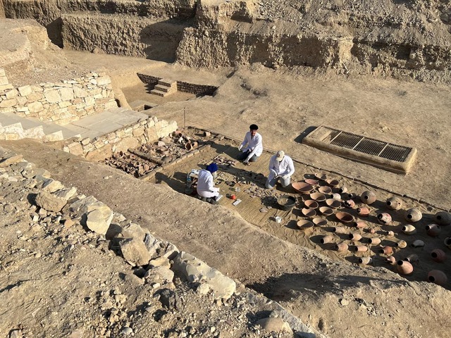 Archaeologists, alongside Zahi Hawass' heritage mission team, carefully unearth and restore artefacts discovered near the Queen Hatshepsut Valley Temple in Deir El-Bahari, Luxor. (REUTERS/Sayed Sheashaa)