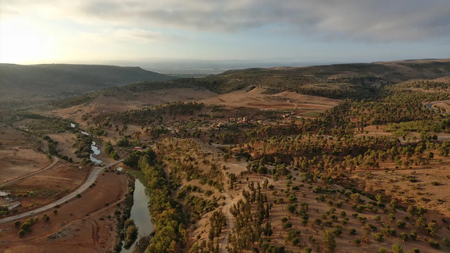 An aerial photograph of the Oued Beht archaeological site from a northern perspective, offering a stunning view of its layout. (Image Credit: Toby Wilkinson, OBAP Archive)