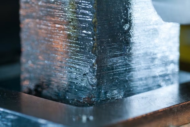 An ice core is carefully extracted from the vast Greenland ice sheet, revealing layers of history frozen in time. (Credit: Joseph McConnell)