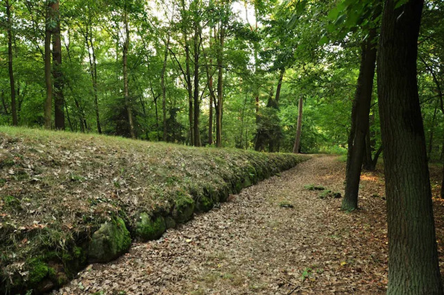 Another perspective of a preserved Polish Pyramid, highlighting the massive stones that form the tomb's foundation