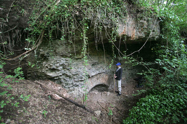 Archaeologist Katherine Rinne stands beside a massive ancient Roman springhouse, believed to be the lost "Carestia" spring, a potential source of the Aqua Traiana.