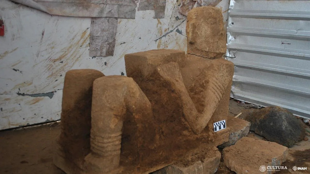 Archaeologists carefully excavating the basalt Chac Mool sculpture at the site in Pátzcuaro, Michoacán. Credit: Luis Punzo – INAH Michoacán Centre.