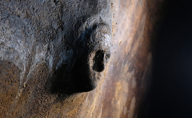 Archaeologists have drawn parallels between the mask and the carved faces found in the Libyan sanctuary of Slonta, suggesting a potential connection to local traditions.