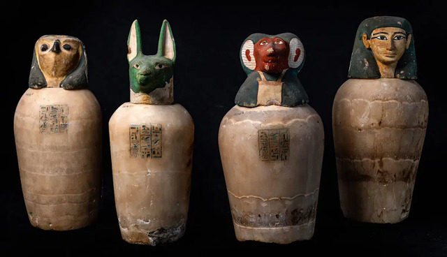 Canopic jars of Isetemkheb from the Third Intermediate Period (ca. 1069-945 BCE), a testament to ancient Egyptian burial practices, courtesy of the Egyptian Ministry of Tourism and Antiquities.