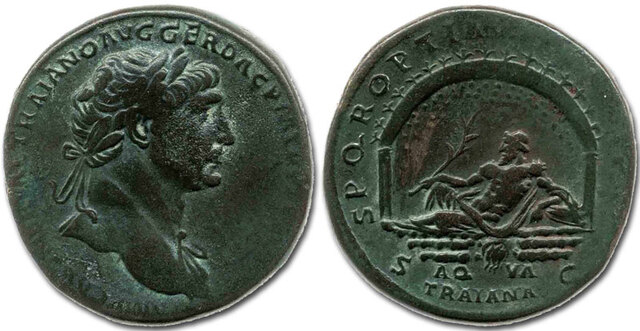 Emperor Trajan commemorated the completion of the Aqua Traiana with a bronze sestertius, depicting his likeness on one side and a reclining god symbolizing the aqueduct, along with an arch representing its grotto-like sources, on the other.