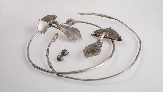 Exquisite silver jewelry, including necklaces and brooches, has been uncovered along the scenic Wda River in Poland. (Image credit: Wdecki Park Krajobrazowy)