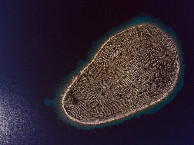 From the sky, it looks like a colossal fingerprint imprinted onto the ocean