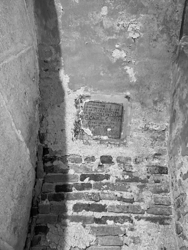 Graffiti etched by prisoners recounting the names of two daring escapees from the New Prisons in Venice’s Doge’s Palace.