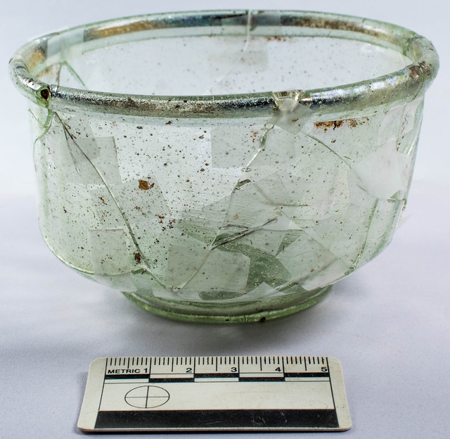 Grave goods, including a delicate glass vessel, were discovered near the coffin, offering a glimpse into the personal belongings of the deceased. (Credit: Headland Archaeology)