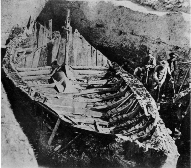 Historical photograph of the Gokstad Ship excavation in 1880, showcasing the remarkable preservation of this Viking burial ship.