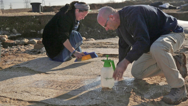 IAA excavation directors Maayan Margulis and Shira Lifshitz carefully clean the mosaic discovered at Kiryat Gat, unveiling its intricate details. (Emil Aladjem/Israel Antiquities Authority, January 6, 2024)