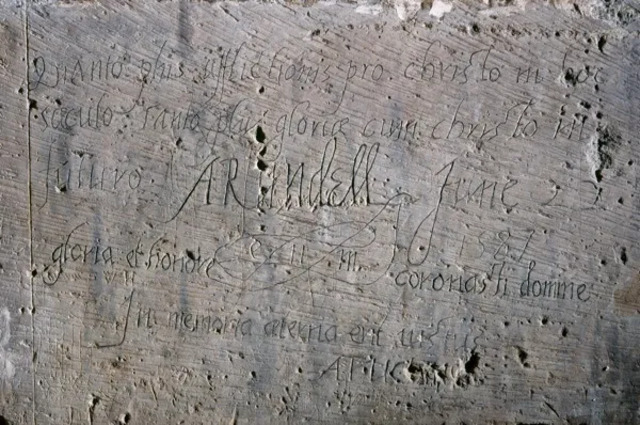 In 1587, Philip Howard, Earl of Arundel, carved this Latin inscription above the chimney breast in the Beauchamp Tower.