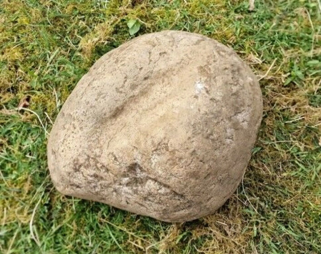 In the boat grave lies a fascinating artifact archaeologists refer to as a vulva stone.