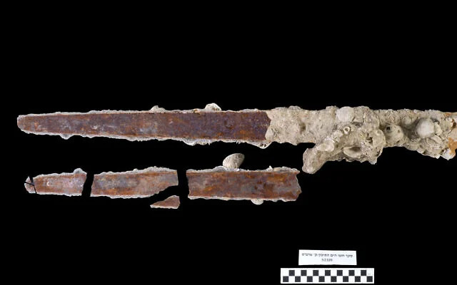 Initial research efforts fractured the marine crust and damaged the iron blade, prompting a shift toward noninvasive study methods. (Credit: Daphna Gazit/Israel Antiquities Authority)