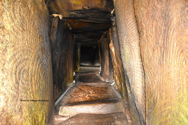 Intricately carved slabs line the passage of the Gavrinis passage tomb, showcasing ancient artistry. (Photo Zulfiqar Ali Kalhoro)