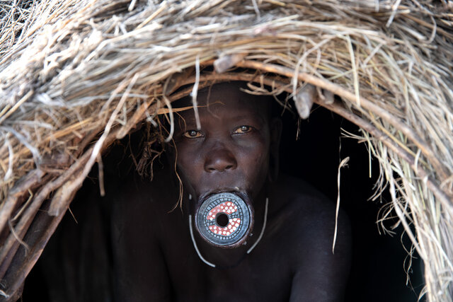 Lip plates, also known as lip discs or lip plugs, are a striking cultural adornment with deep traditional roots. (Credit: Jayne Mclean)