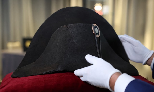 Napoleon’s iconic bicorne hat, crafted from black beaver felt and adorned with an embroidered tricolour cockade, a detail he is said to have added personally in 1815. (Photograph: Claudia Greco/Reuters)