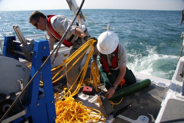 Parks Canada team preparing magnetometers and sonar technology to map the wreck sites with precision.