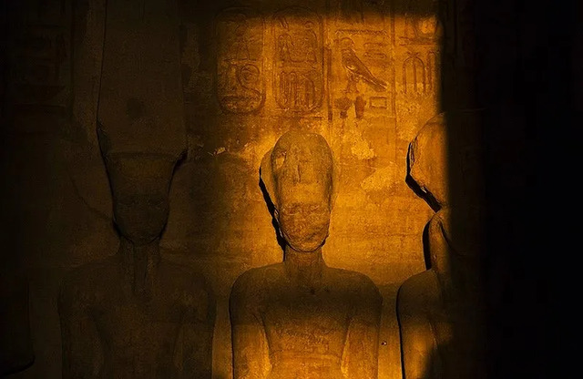 Ramesses II glows with divine radiance as he sits among Ra-Horakhty, Amun-Ra, and Ptah.