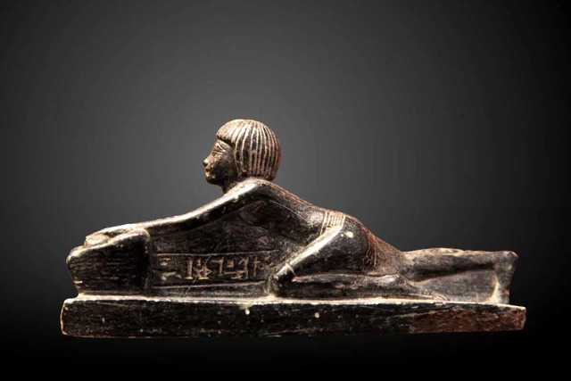 Royal Daily Life: A statuette of Crown Prince Thutmose grinding grain, dating to the 14th century BCE, currently preserved at the Louvre. (Image via Wikimedia Commons)