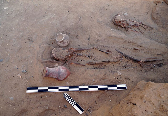 Skeleton remains with pottery artifacts unearthed during the excavation at Saqqara, shedding light on burial customs from the 18th Dynasty. Credit: Ministry of Tourism and Antiquities of Egypt.