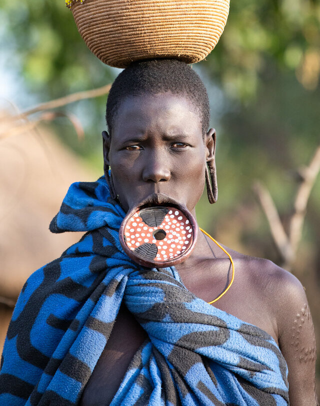 The Surma people remain one of the last tribal groups in Africa where the lip plate is still a common practice among women, preserving a piece of cultural heritage. (Credit: Jayne Mclean) 