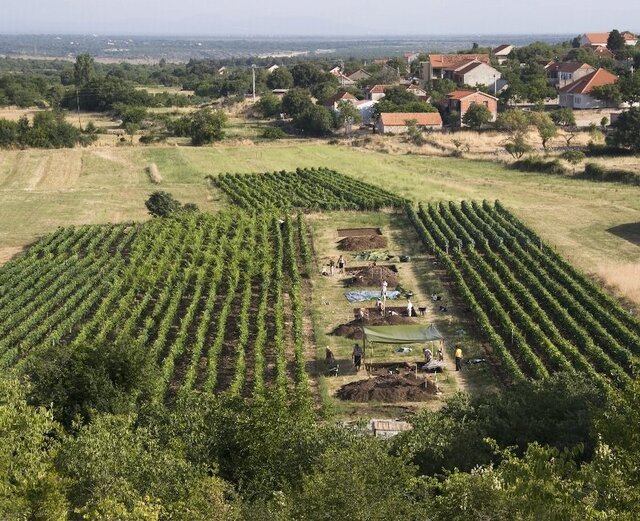 The archaeological site in Dalmatia, Croatia, offers a glimpse into Neolithic life, with the modern village visible in the background. (Credit: Andrew M.T. Moore)