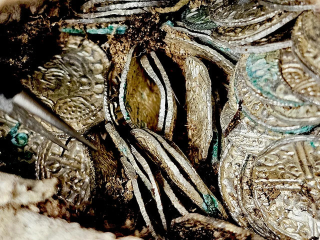 The coins, minted in various locations, reflect the diverse economic networks of the 11th century. (Credit: Oxford Cotswold Archaeology)