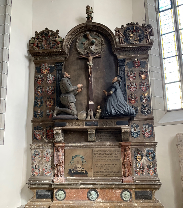 The coins were astonishingly discovered hidden inside the leg of the kneeling count statue at St. Andrew's Church in Eisleben, Germany, unveiling a centuries-old secret.