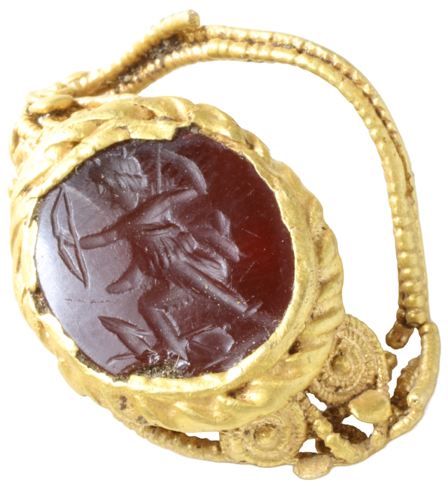 The detailed craftsmanship of the Diana Venatrix intaglio ring, showcasing the engraving of Diana with her bow and hunting dog on a carnelian gemstone.