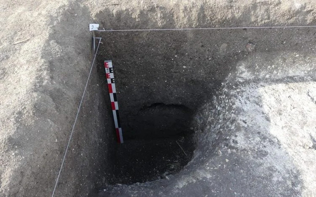 The excavation of a deep well, part of the Neolithic village's infrastructure, offering insights into water management practices. (Credit: Rémi Martineau/CNRS)