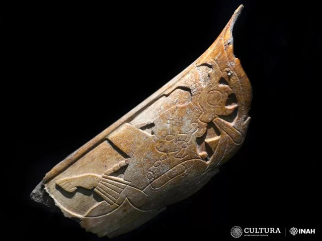 The intricately carved Maya nose ornament, crafted from human bone, features elaborate engravings and is thought to have been used in ceremonial rituals. (Credit: Carlos Varela Scherrer / INAH)