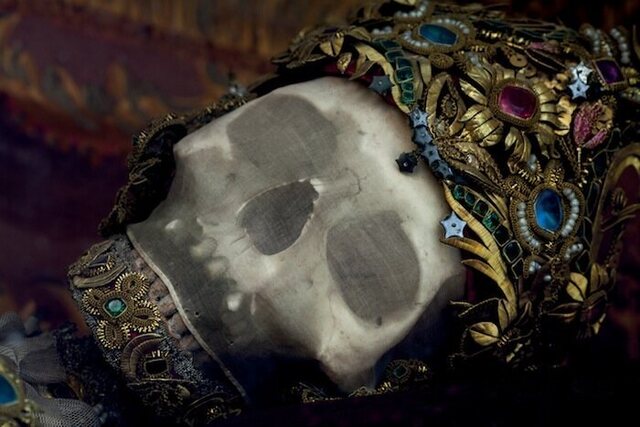 The skull of St. Getreu in Ursberg, Germany, is draped in silk mesh and fine wirework embedded with gemstones, possibly crafted in Mindelheim, Germany. (Copyright: Paul Koudounaris)