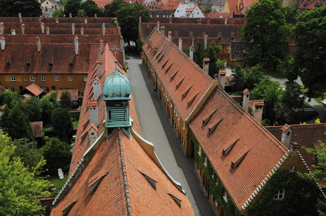 The stunning St. Mark’s Church and the scenic Herrengasse, central landmarks of the Fuggerei.