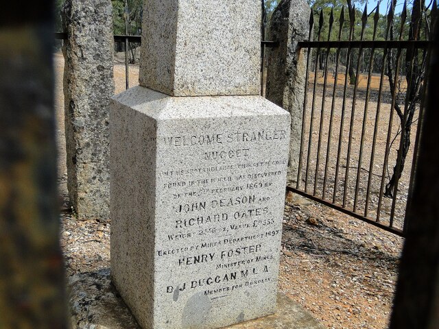 The text etched on the commemorative obelisk, encircled by elegant pillared railings, preserves the story of this remarkable gold nugget.