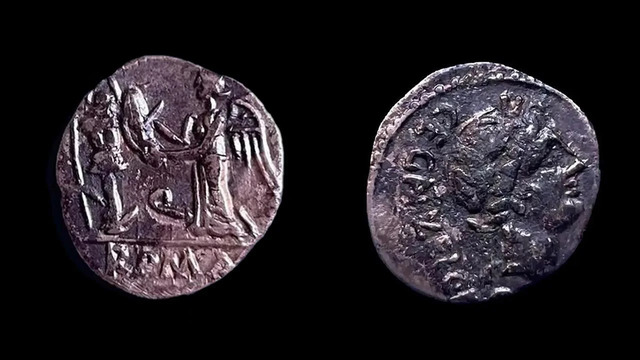 Two rare Roman coins unearthed in Claterna, featuring intricate engravings that highlight the city's economic and cultural significance.